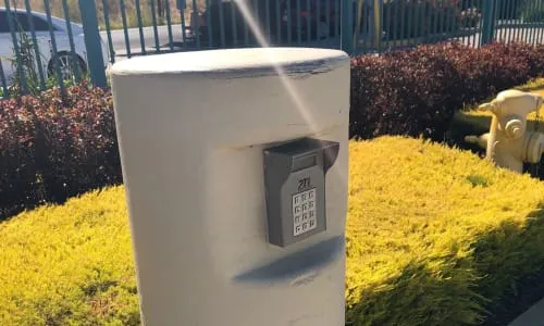 Keypad entry for security gate access.