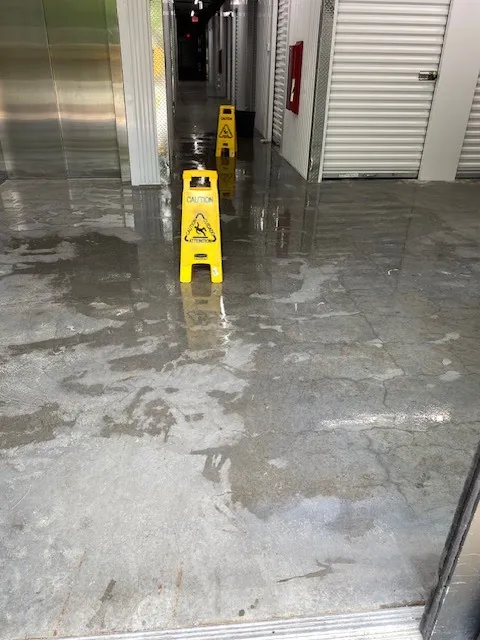 Indoor hallway with wet floor warning signs