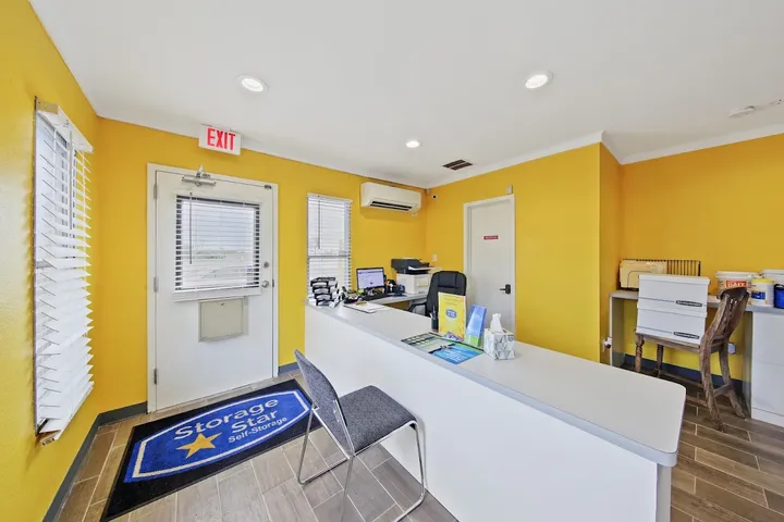 Front desk of the storage facility office with yellow walls.