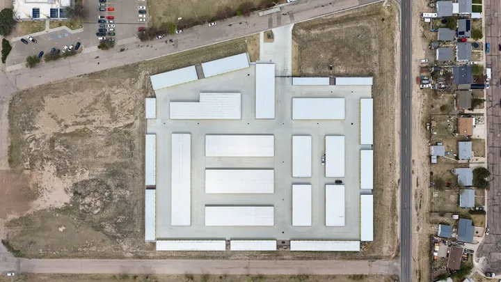 Aerial view of self-storage facility layout with multiple buildings.