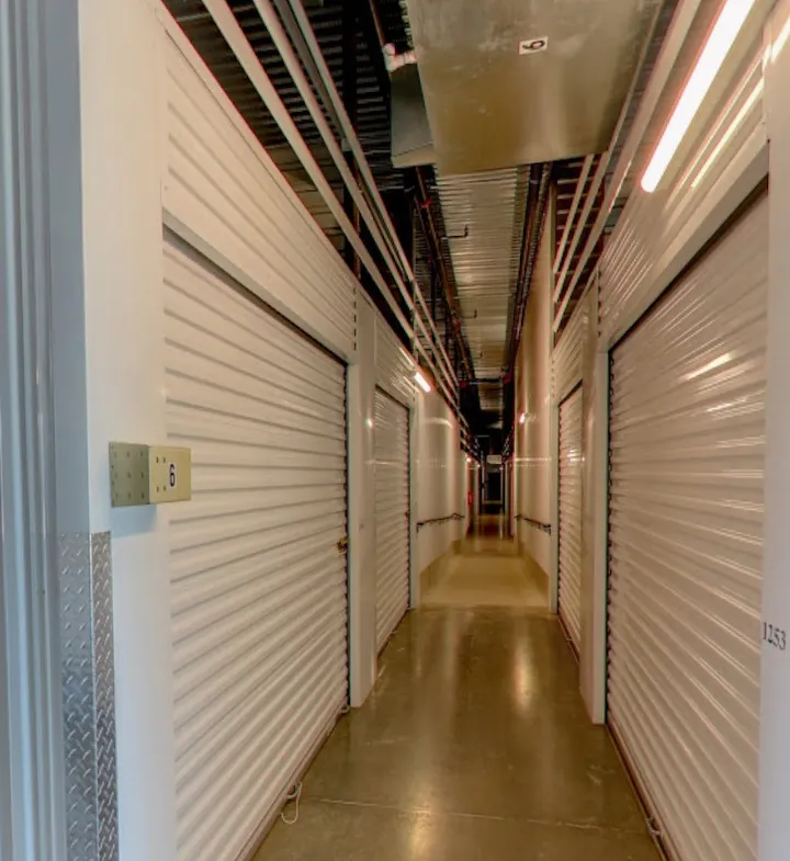 Indoor hallway with white storage unit doors.