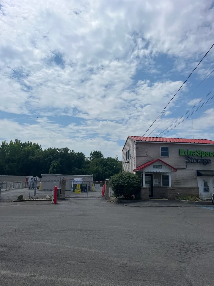 Exterior view of the Extra Space Storage office building and entrance gate.