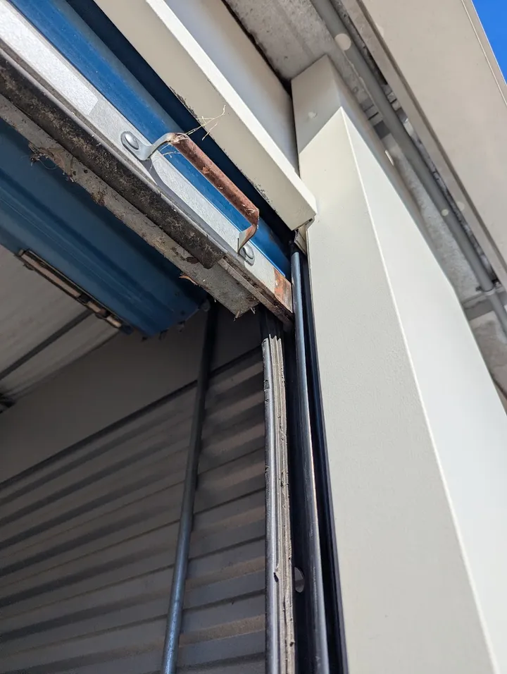 Close-up of storage unit door track.