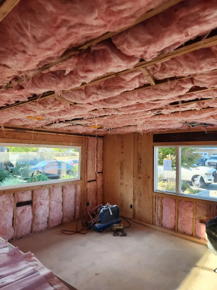 Room interior under construction with pink insulation