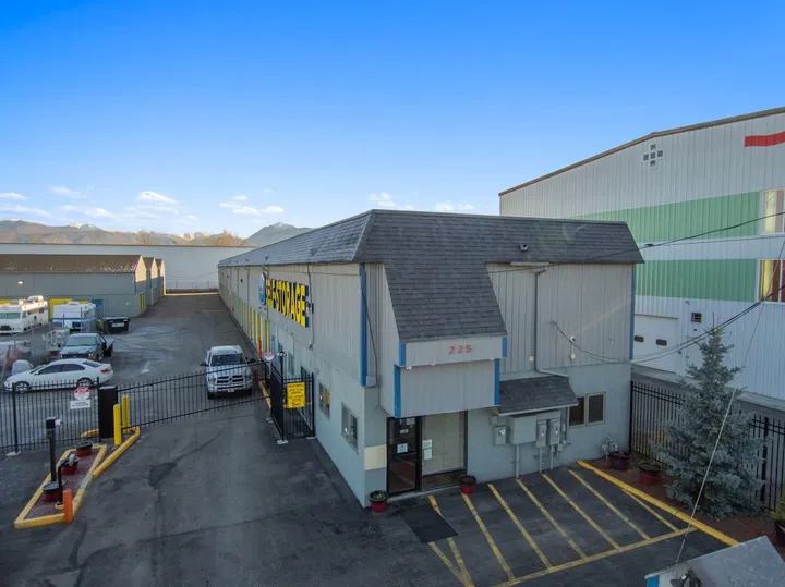 Aerial view of storage facility with office and outdoor parking.