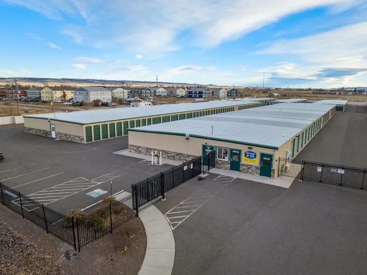 Office building with storage units and neighborhood in background