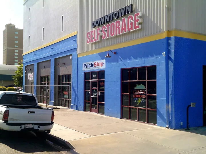 Exterior of building entrance with 'Downtown Self Storage' sign.