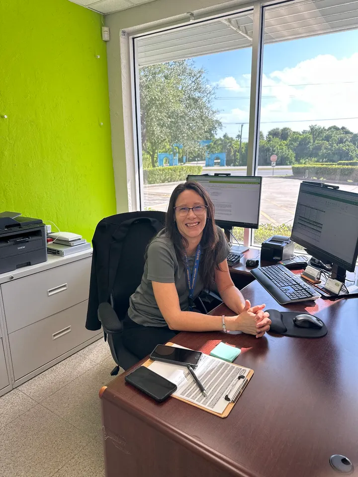 Team member sitting at the office desk.