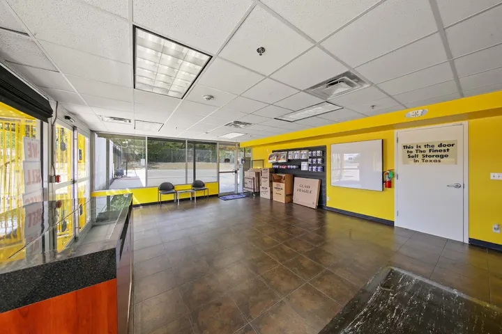 Customer service office with packing supplies and seating.