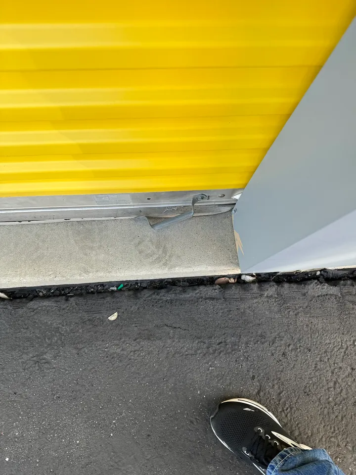 Bottom of a yellow roll-up unit door