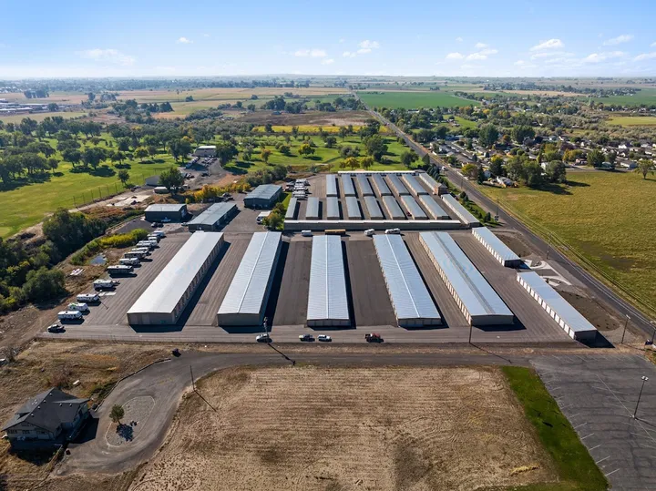 Aerial view of the storage facility with multiple buildings and parking.