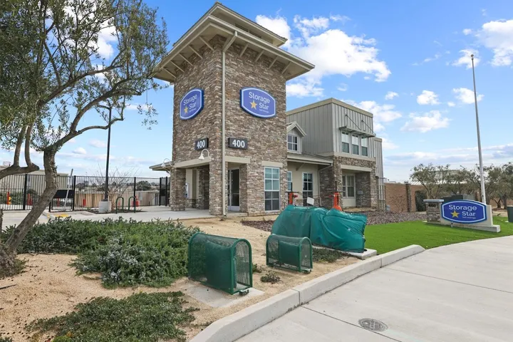 Exterior view of the facility with main building and storage units.