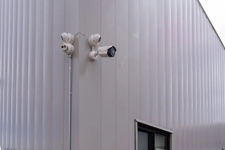 Security cameras mounted on the exterior of the building.