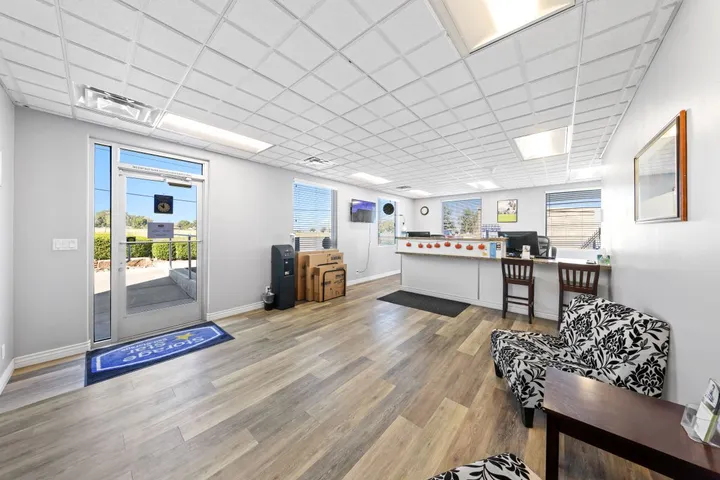 Interior of the storage facility's leasing office with reception desk.