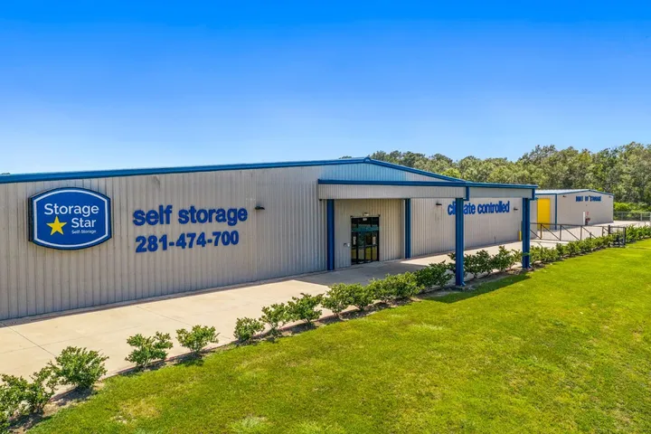 Exterior of self storage building with signage and climate-controlled text