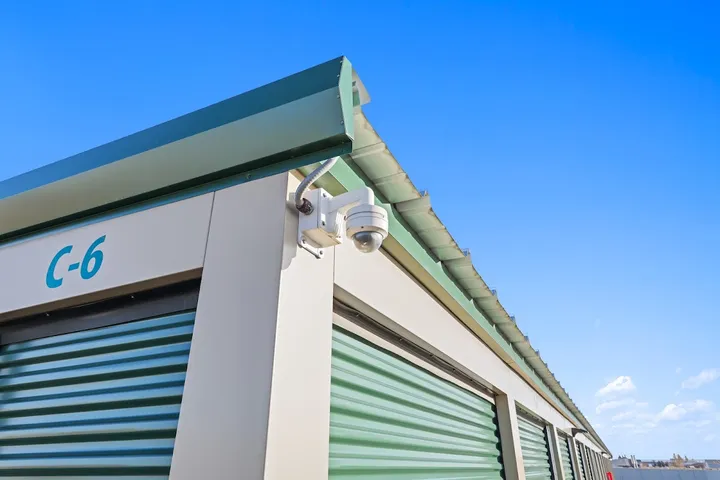 Security camera mounted on outside of storage building