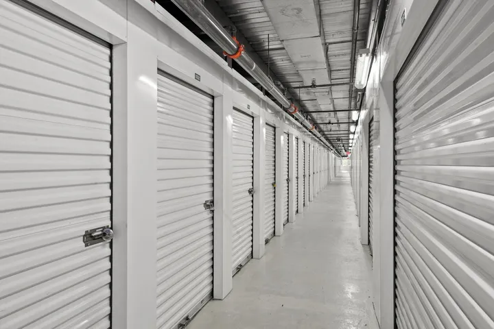 Long interior hallway of climate-controlled storage units.