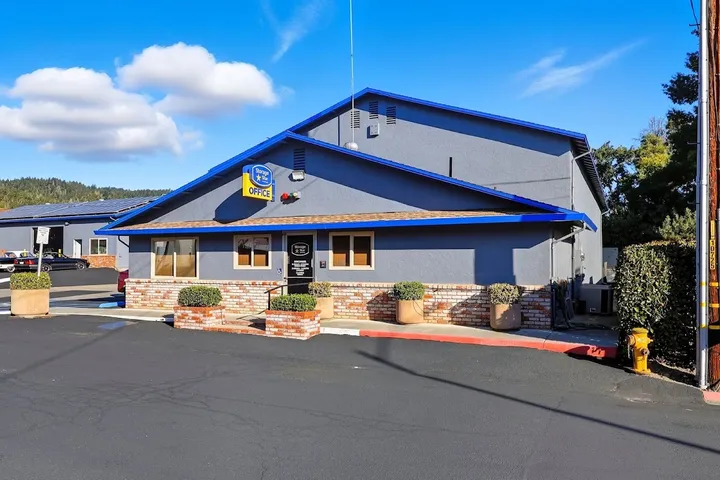 Front of the rental office with signage and brick accents