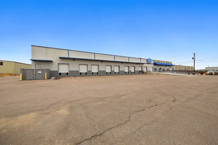 Panoramic view of self storage facility building and parking lot