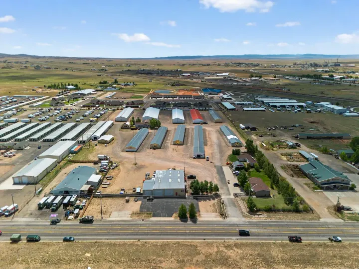 High-angle aerial view of Storage Star Self-Storage in Laramie on Skyline Road, with multiple rows of metal drive-up buildings